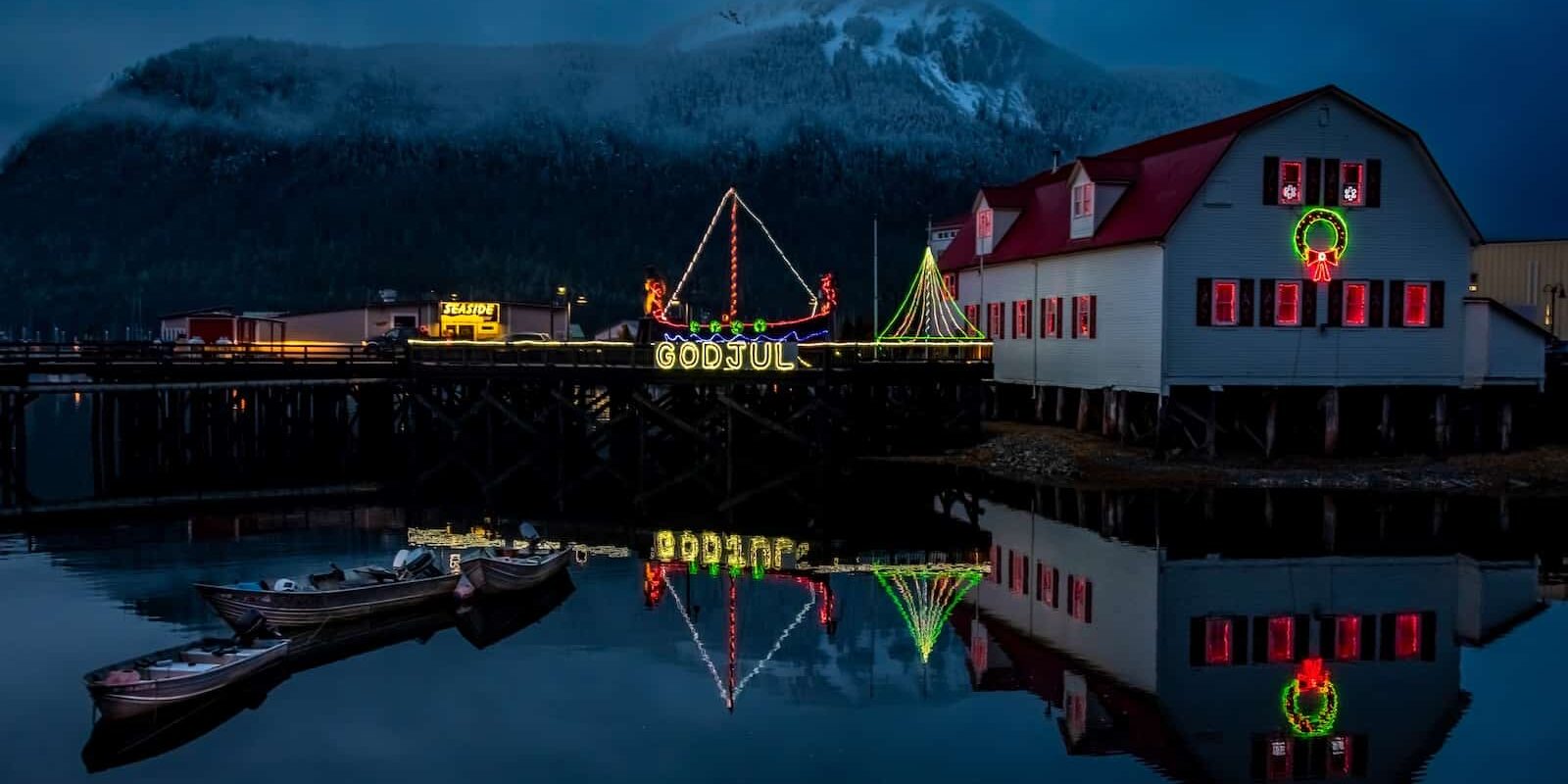 Petersburg's iconic Sons of Norway Hall overlooks the harbor, adorned with festive lights that brighten Southeast Alaska's winter nights.
