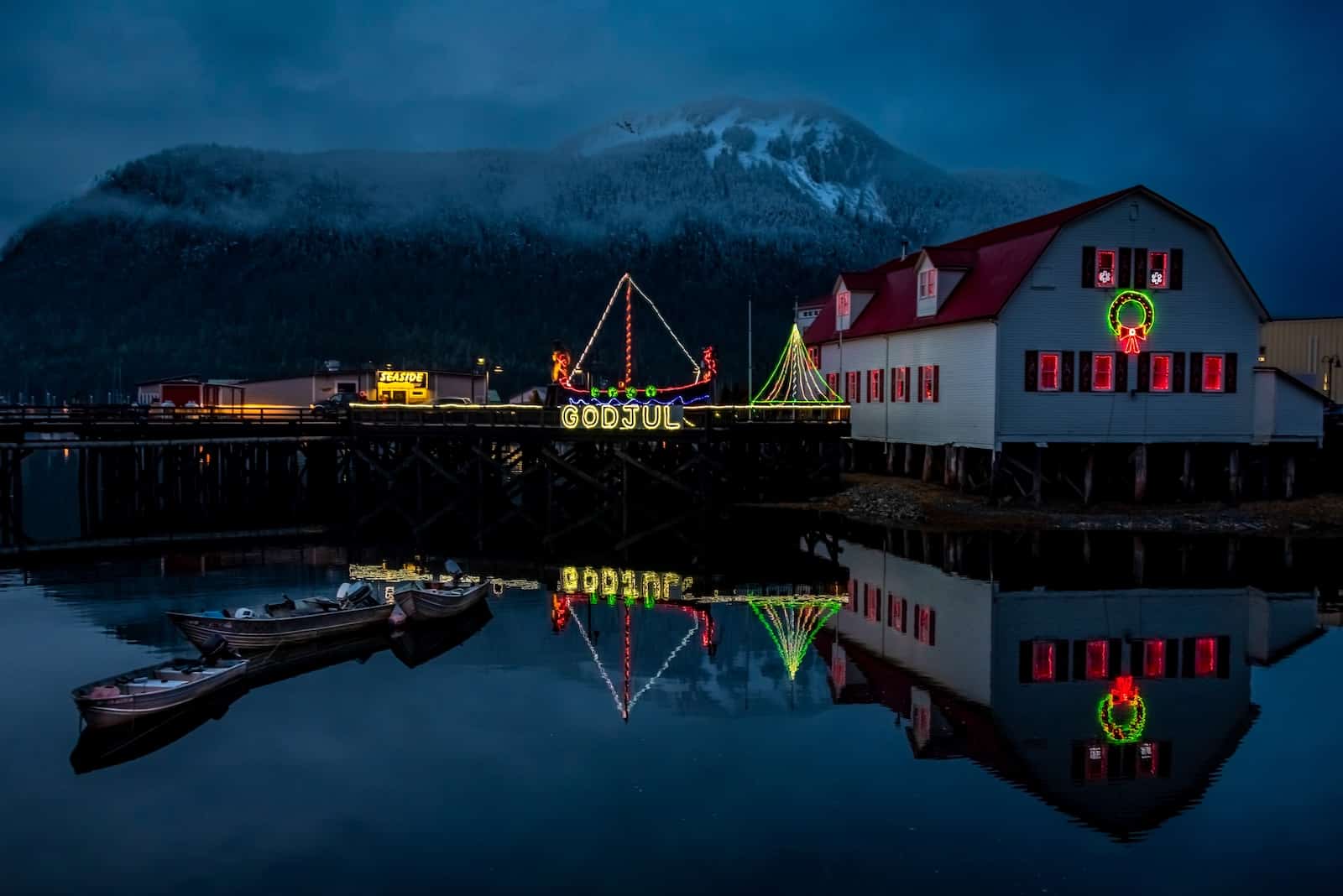 Petersburg's iconic Sons of Norway Hall overlooks the harbor, adorned with festive lights that brighten Southeast Alaska's winter nights.
